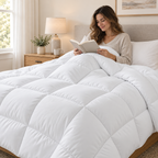 Woman reading in bed under a white quilted comforter duvet insert