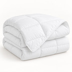 Folded white quilted comforter duvet insert with piped edges