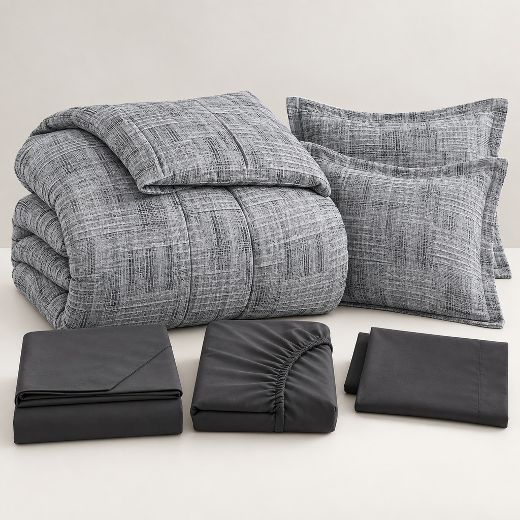 Folded charcoal grey 7-piece comforter set with sheets, pillowcases and shams