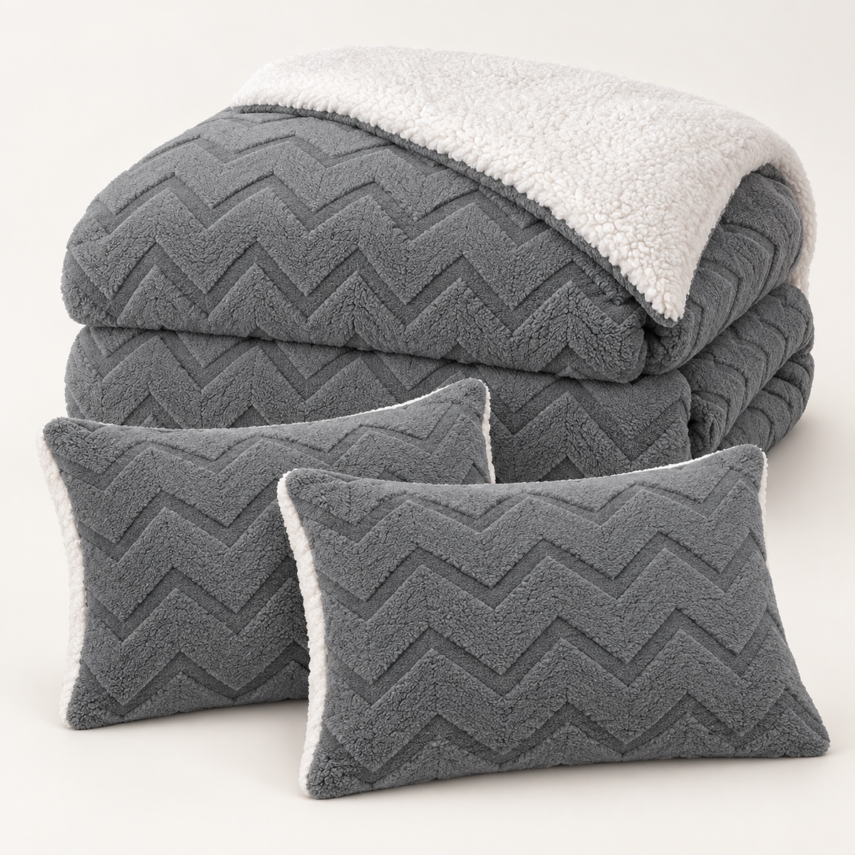 Grey three-piece sherpa comforter set with one comforter and two matching pillowcases