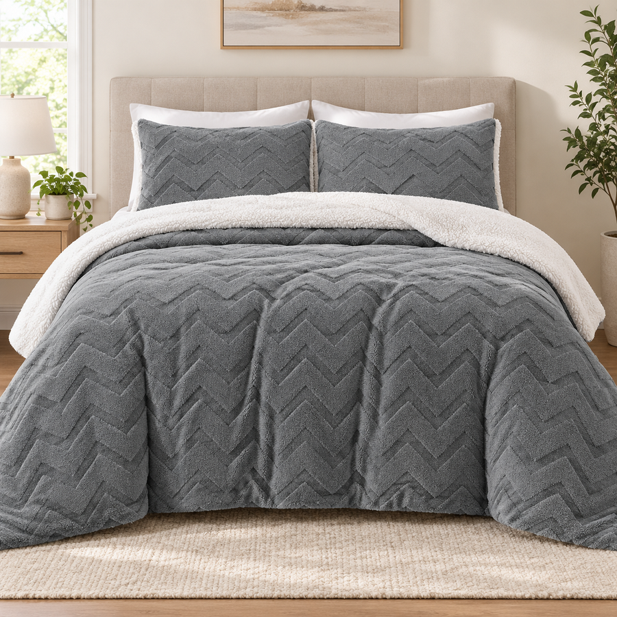 Grey sherpa comforter set with two matching chevron pillowcases on a queen bed